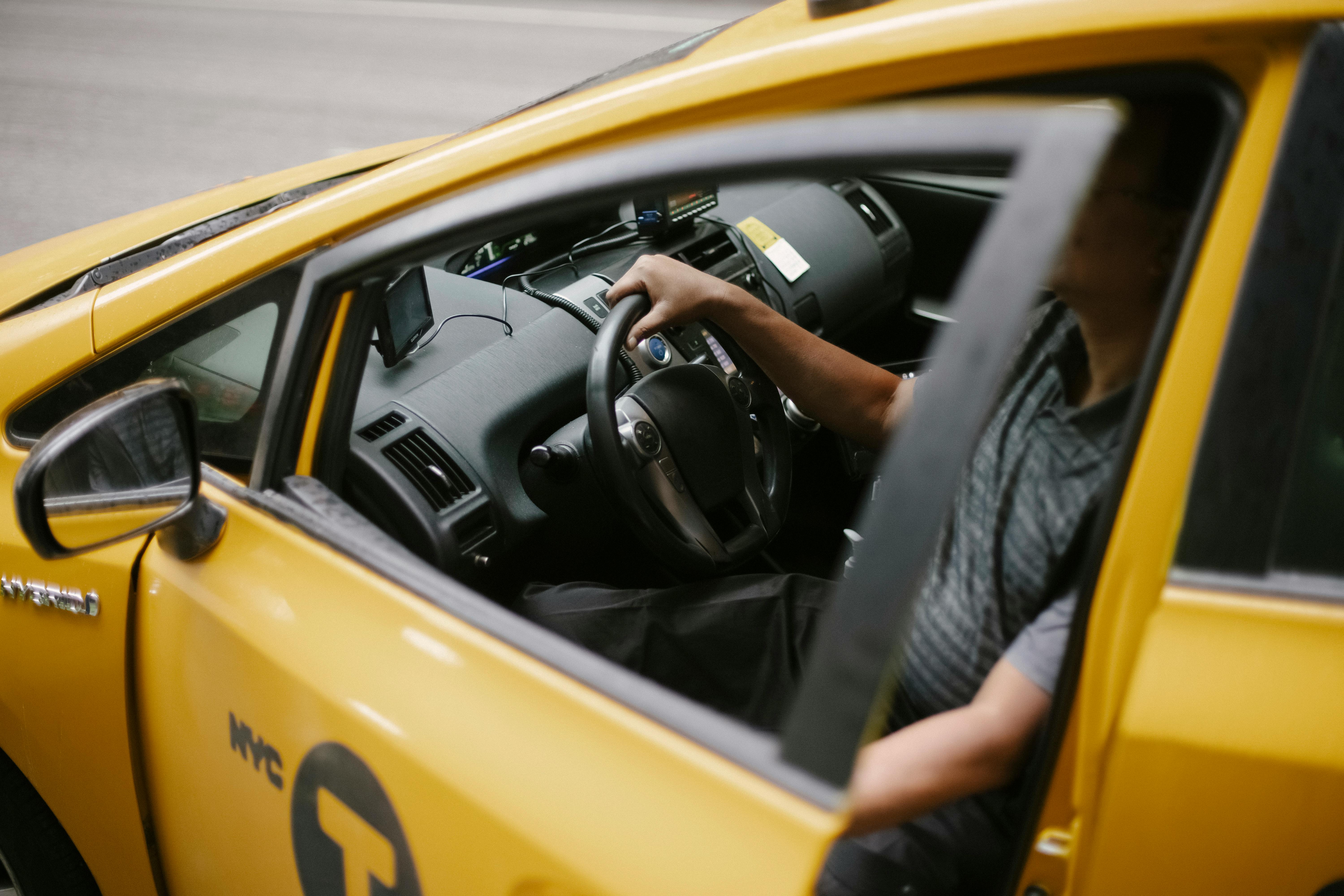 A driver sits in a taxi cab in New York City.